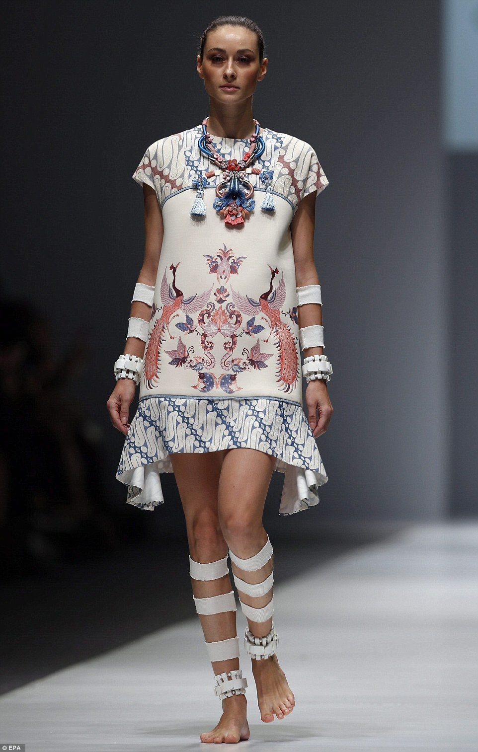 2DDF35AF00000578-3293566-A_model_wears_the_minimal_shaped_dress_with_arm_and_leg_cuffs-a-37_1446050263344