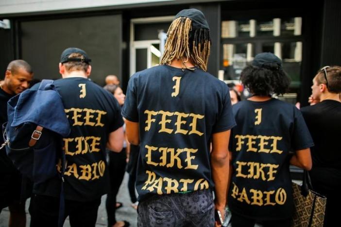 People wear "The life of Pablo" merchandise after visiting the pop up store featuring fashion by Kanye West in Manhattan, New York, U.S., August 19, 2016. REUTERS/Eduardo Munoz