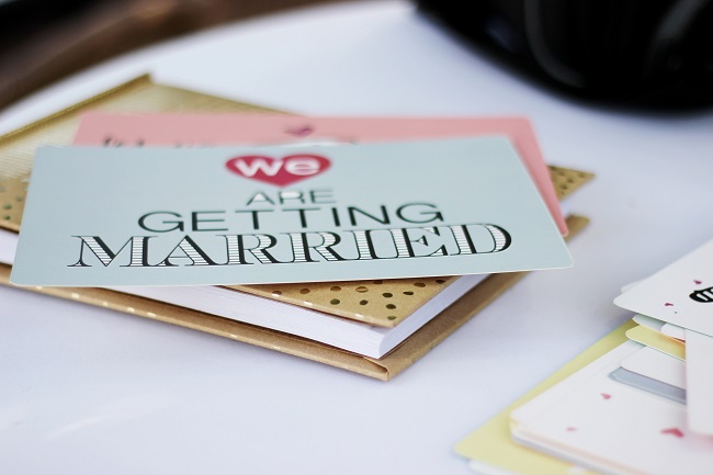 Photo of "we are getting married wedding inviation placard"