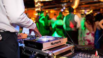 Photo of a DJ mixing a song at a wedding reception