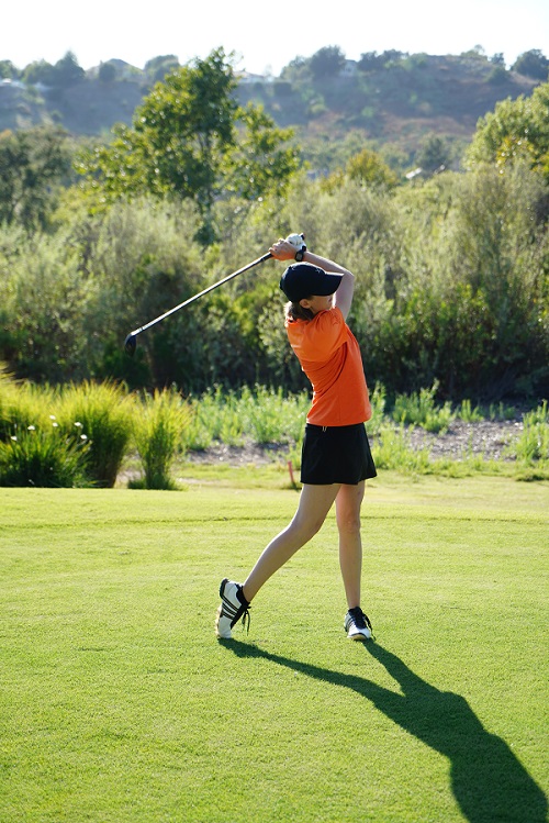Woman Playing Golf on a Golf Course