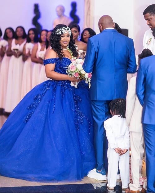 Bride and groom in unconventional blue wedding dress - photo