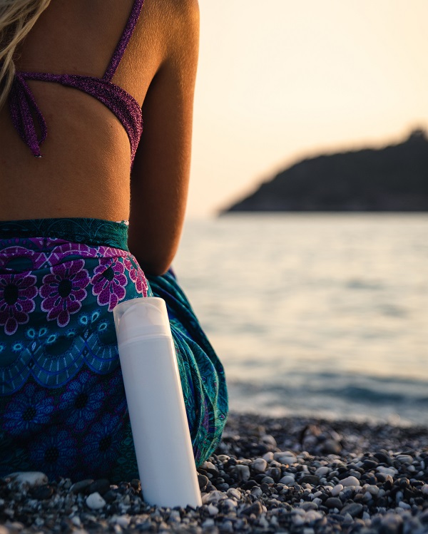 Woman Applying Sunscreen