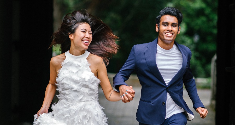 Photo Of Bride and Groom Running
