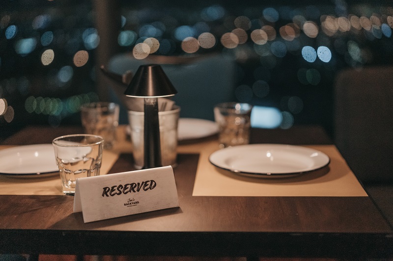 A table with reserved sign for the guests
