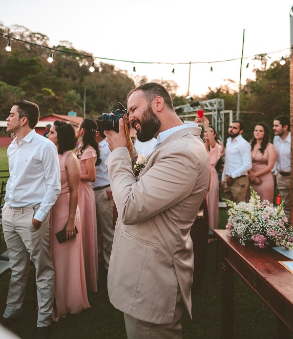 Photo of a wedding photographer taking pictures of the bride