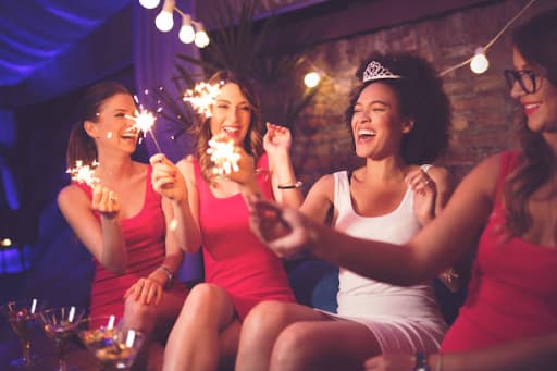 Photo of happy bridesmaids with the bride during a bridal shower