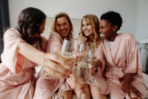 Photo of happy bridesmaids with the bride during a bridal shower