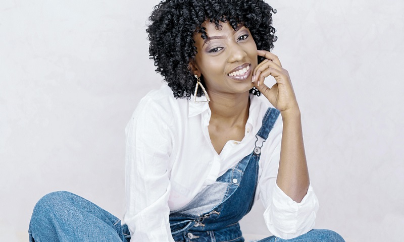 Photo of African American Woman Wearing Denim Dungaree