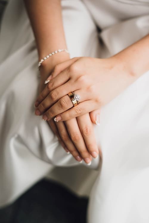 photo of a bride showing off her diamond engagement ring