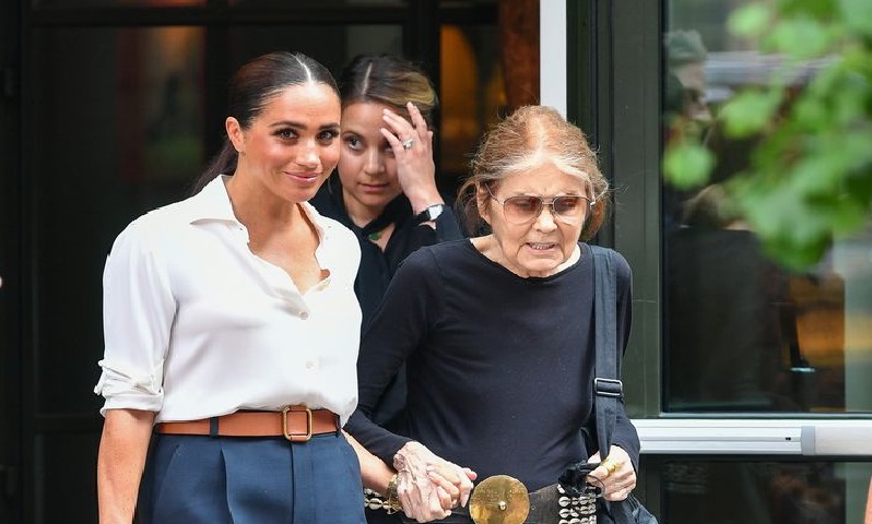 Meghan Markle Looks Polished In Slouchy White Shirt and Navy Shorts