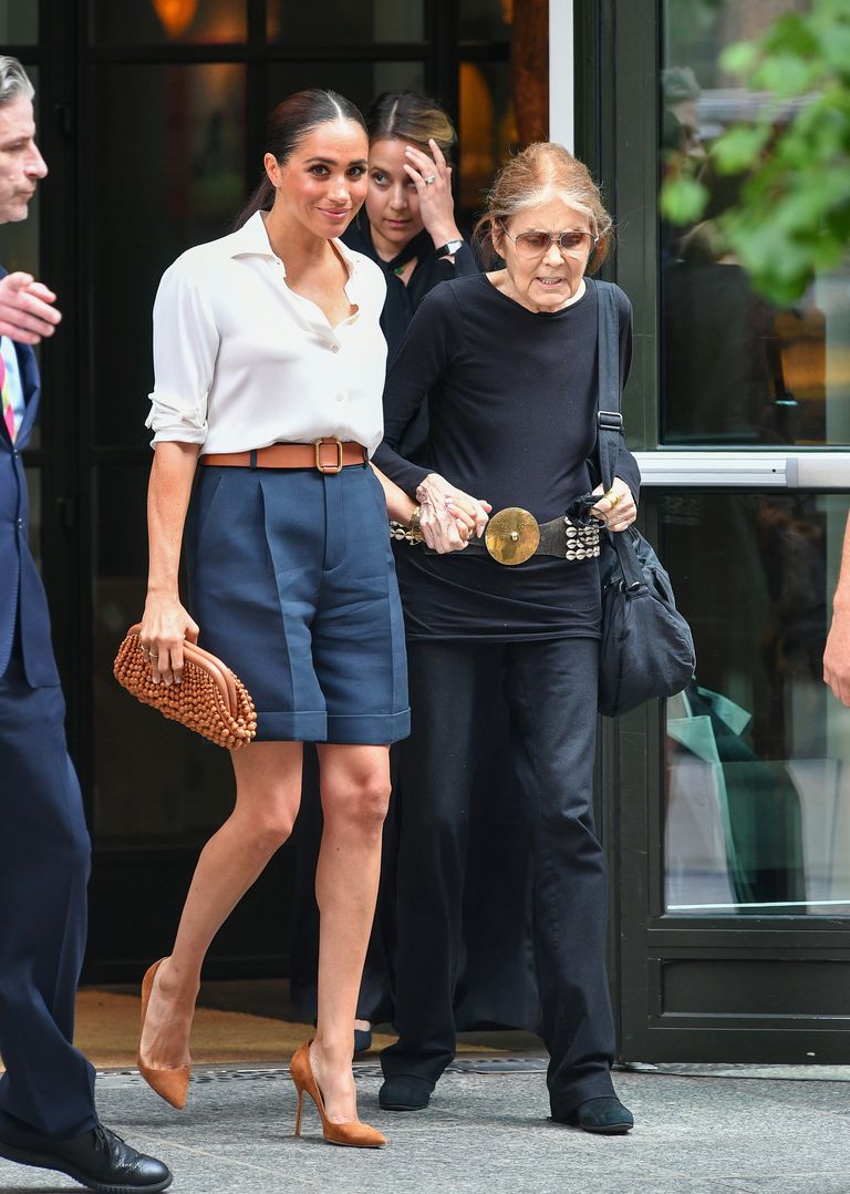 Meghan Markle Looks Polished In Slouchy White Shirt and Navy Shorts