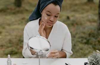 african-american-woman-applying-night-cream-image