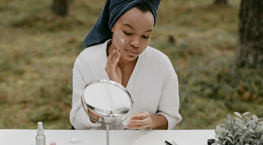 african-american-woman-applying-night-cream-image
