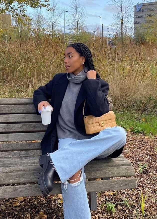 Woman wearing baggy denim jeans and boots photo