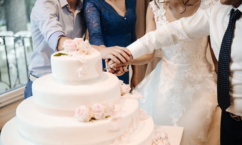 Bride Groom Cutting Cake Photo