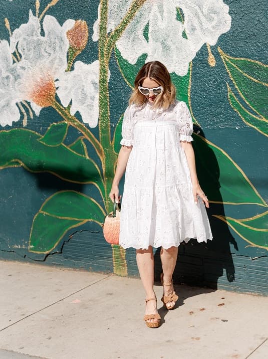 Petite woman wearing midi dress photo