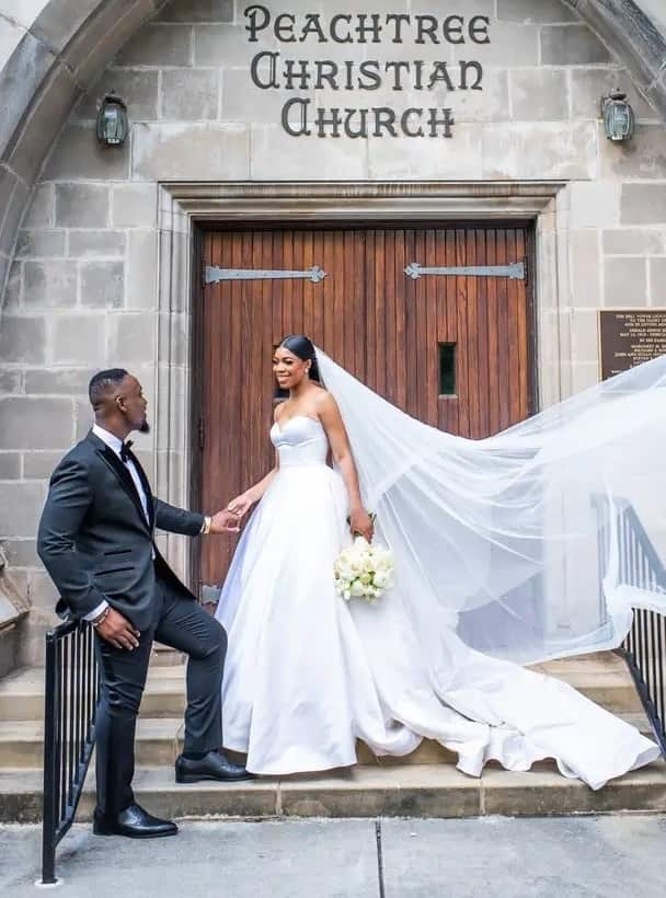 Bride and groom in front of the church