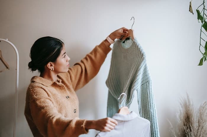 Photo of woman holding sustainable clothes