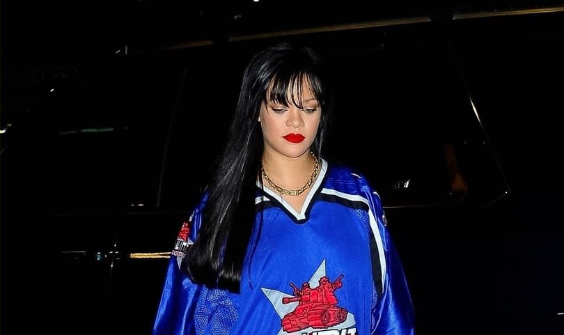 Photo of Rihanna stepping out in NYC in a blue jersey top and baggy jeans