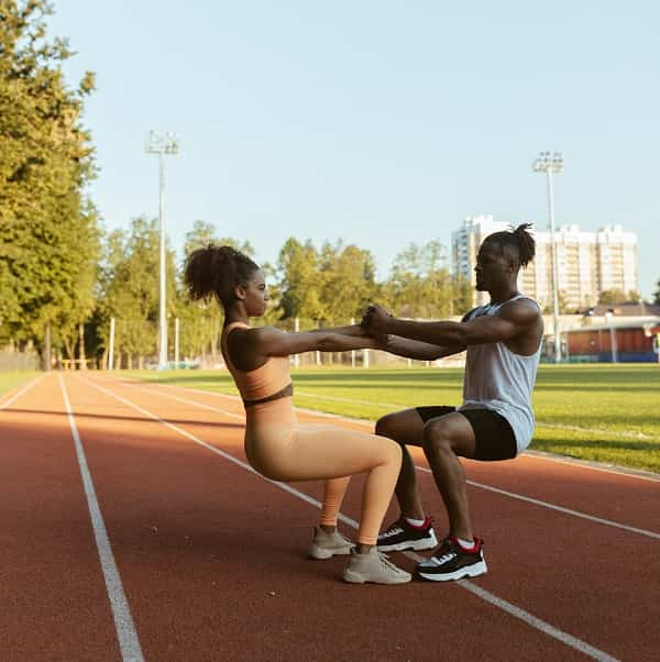 African American Woman with boyfriend Workout