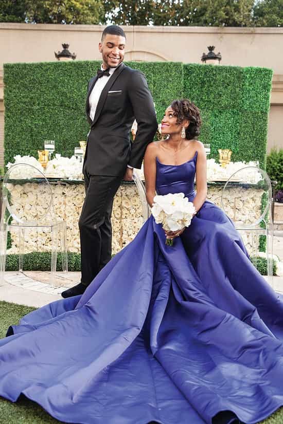 Unconventional bride wearing blue wedding dress