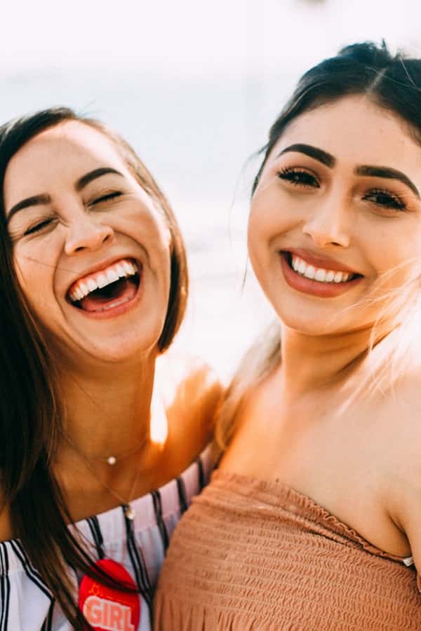 Women smiling and shining teeth