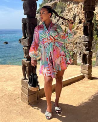 Photo of a woman wearing colorful wrap dress