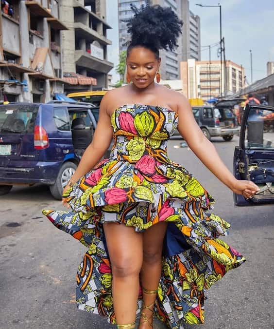 Yemi Alade wearing African prints dress on the set of her music video - Fashion Police Nigeria