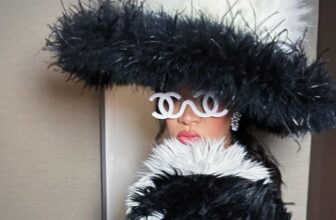 Rihanna Wears A Dramatic White Feathered Dress To Tease Her Met Gala Look