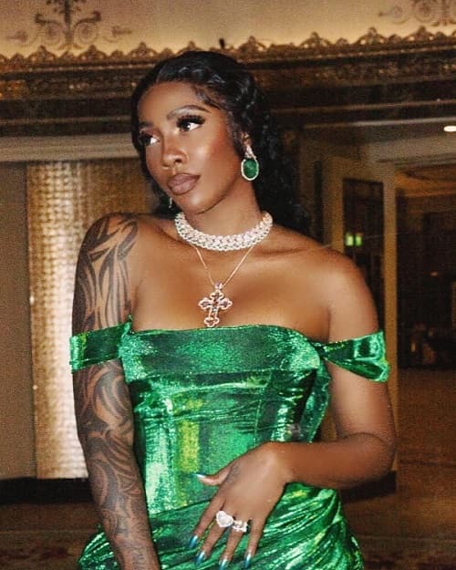 Photo of Tiwa Savage Green Gown by Lanre Da Silva During Her Performance at the Coronation of King Charles and his wife, Camila - Fashion Police Nigeria