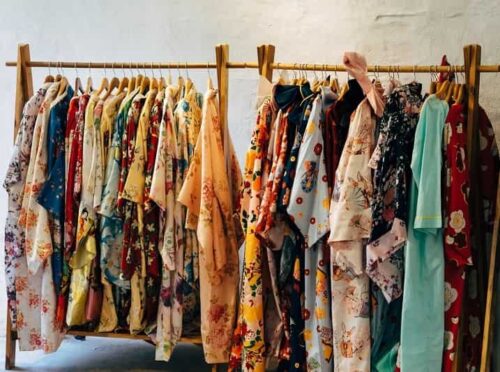 Photo of secondhand clothes displayed in a hanger