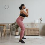 photo of a woman working out at home - Fashion Police Nigeria