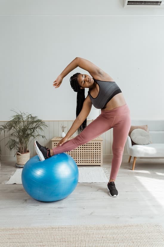 photo of a woman working out at home - Fashion Police Nigeria