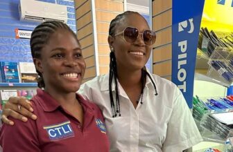 Yvonne Nelson wears cornrow hairstyle with white shirt and black pants during "I Am Not Yvonne Nelson" book signing tour in Ghana