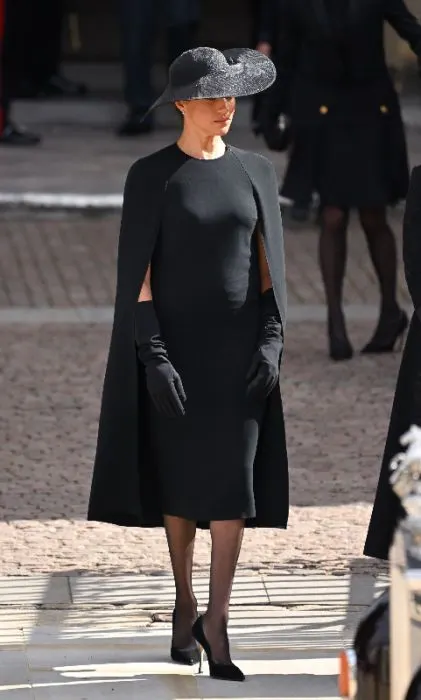 Photo of Meghan Markle wearing a black cape dress during Queen Elizabeth's funeral - Fashion Police Nigeria