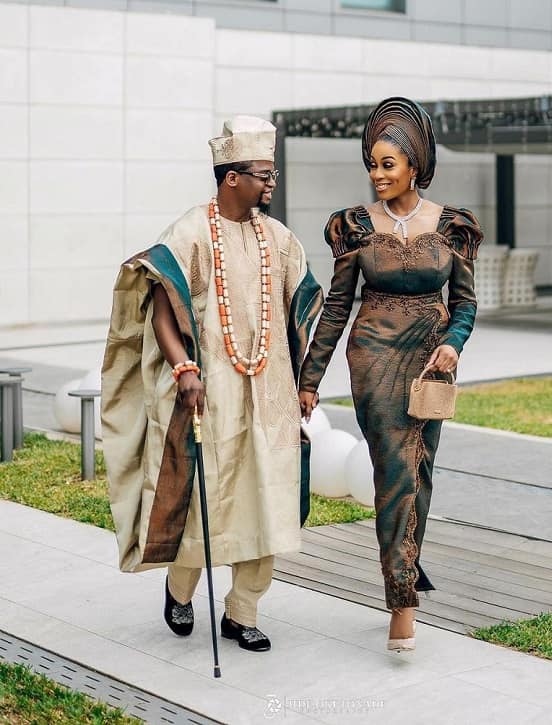 Photo of Nigerian Yoruba bride walking with groom - Fashion Police Nigeria