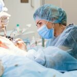 Woman cosmetic surgeon performing surgery on a patient photo - Fashion Police Nigeria