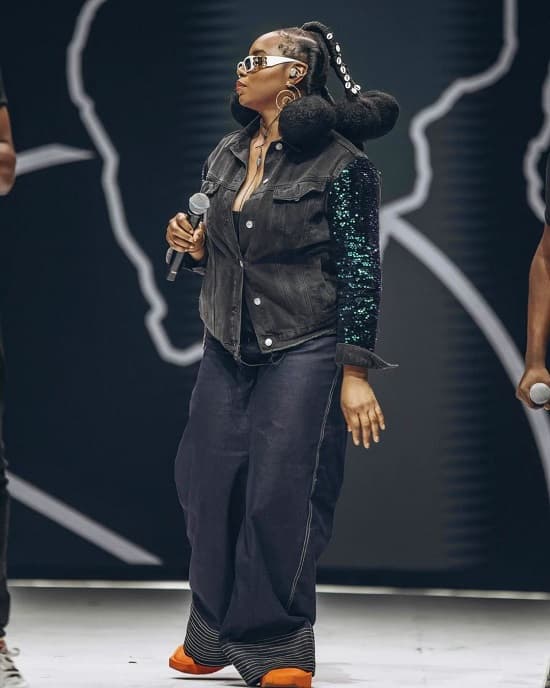 Yemi Alade wears denim jacket and denim baggy pants to sing Akwaba, the official CAF 2023 anthem, alongside Magic Systems band and Mohamed Ramadan