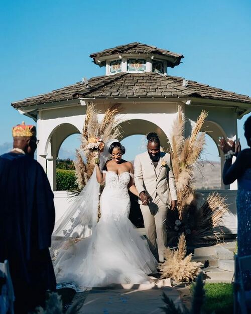 Bride and groom walking after their vintage country wedding in Nigeria - Fashion Police Nigeria