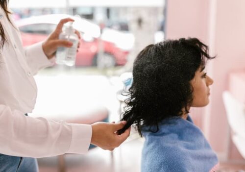 Woman cutting hair photo in the salon - Fashion Police Nigeria