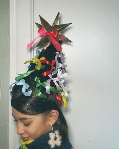 Christmas tree-inspired hairstyle with bows photo