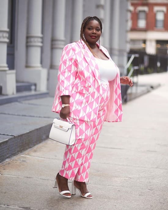 Photo of a curvy plus size woman dressed in a pantsuit - Fashion Police Nigeria