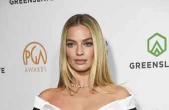 Margot Robbie’s Little Black Balmain Dress Pays a Tribute to the Vintage Barbie