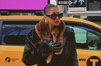 A photo of woman wearing a fur coat for the mob wife fashion trend - Fashion Police Nigeria