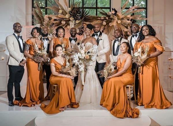 Photo of bridesmaids posing for a photo with the bride at the center - Fashion Police Nigeria