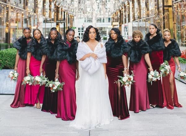 Photo of bridesmaids posing for a photo with the bride at the center - Fashion Police Nigeria