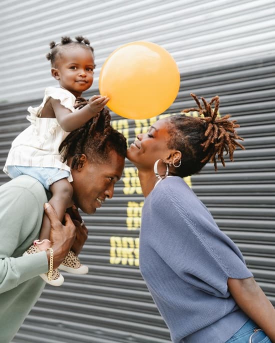 Photo of mom and dad playing with child for mothers day celebration - Fashion Police Nigeria