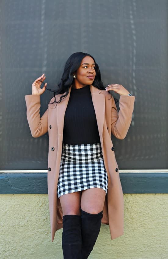 Stylish African woman-posing-in-long brown coat gingham mini skirt and knee high booties photo - Fashion Police Nigeria
