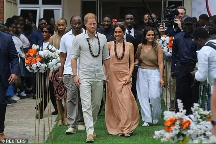 Photo of Meghan Markel wearing sleeveless beige dress on her first visit to Nigeria with Prince Harry - Fashion police Nigeria